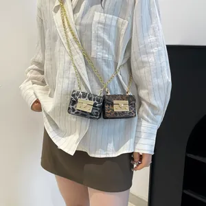 Mini leopard print crossbody bags with gold chains and metallic clasp closure in two colors