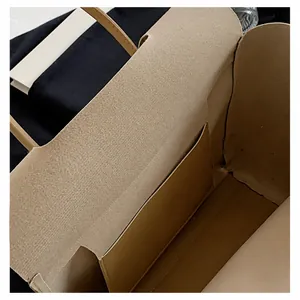 Close-up of beige tote bag interior featuring an open pocket and leather texture detail