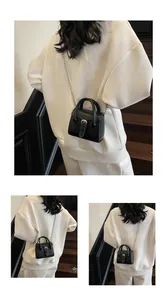 Three-way view of a black mini chain crossbody bag worn with casual white outfit