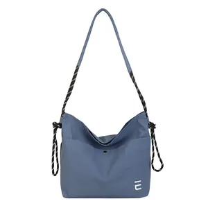 Waterproof nylon crossbody bag in grey-blue with rope strap for casual daily use