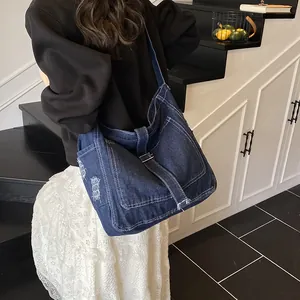 Retro denim tote bag in dark blue with contrast stitching and shoulder strap style