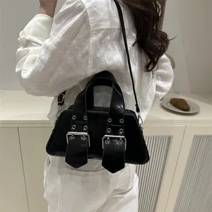 Retro punk style black patent leather shoulder bag with rivets and metal buckles