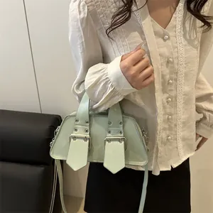 Retro punk mint green tote bag with silver rivets and double buckle straps