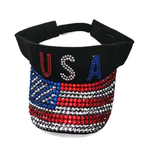 Detail of USA letters and American flag pattern made of rhinestones on black sun visor hat