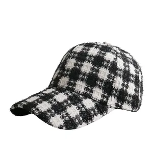 Women's black and white plaid bouclé baseball cap with structured curved brim for winter