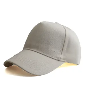 Detail view of the stitching and cotton twill texture on this beige five-panel baseball cap