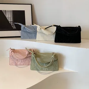Minimalist square handbags in five colors with twisted handles and pleated texture