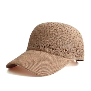 Detailed view of breathable hollow knit pattern on beige baseball cap crown