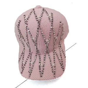 Pink knit baseball cap featuring star patterns with rhinestones and white pearls