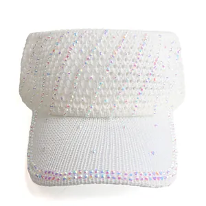 Close-up of white knitted sun visor hat featuring decorative colorful rhinestones