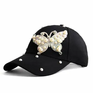 Women's black baseball cap with luxury pearl butterfly embellishment and rhinestones