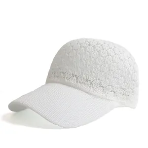 Close-up of white knitted mesh baseball cap showing breathable hollow weave pattern
