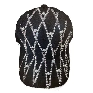 Detailed view of black knitted baseball cap with rhinestone and pearl diamond patterns