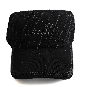 Close-up of black knitted sun visor with luxury sparkling rhinestone diagonal patterns