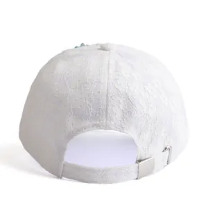 White lace baseball cap with floral embroidery and adjustable silver metal buckle