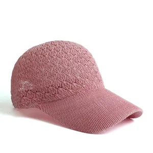 Pink knit baseball cap featuring breathable hollow leaf patterns for outdoor sun protection