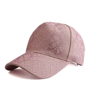 Detail of pink canvas baseball cap with M letter rhinestone pattern and diamond grids