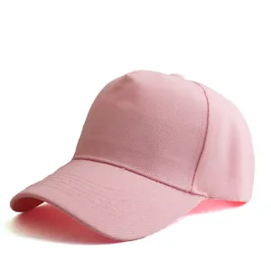 Detail view of pink cotton five-panel baseball cap showing curved brim and side structure