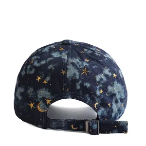 Denim baseball cap with starry sky tie-dye effect and gold moon star patterns