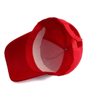 Detail view of red cotton baseball cap interior with sweatband and adjustable strap