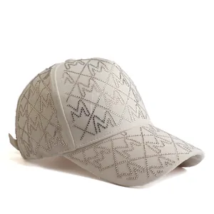 Beige baseball cap with sparkling M rhinestone patterns and diamond lattice design