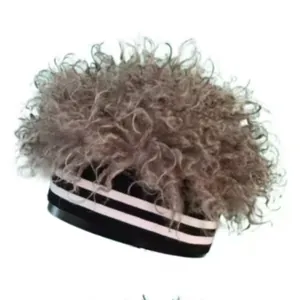 Detail of grey wig beanie with fluffy top and black and white striped elastic band