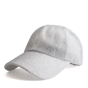 Detailed macro shot of shimmering rhinestones on a stylish silver baseball cap surface