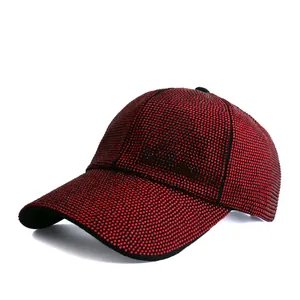 Close-up of bright red rhinestones on a stylish baseball cap with black trim details