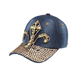 Dark blue denim baseball cap with amber rhinestone fleur-de-lis and studded brim