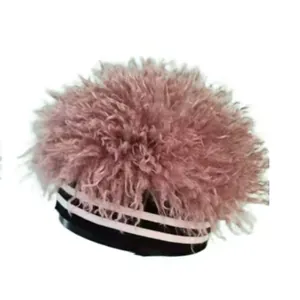 Furry pink beanie hat with a black and white striped elastic band for winter style