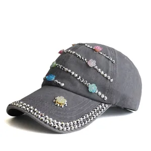 Detail of dark gray cotton baseball cap with colorful 3D resin flowers and silver rhinestones
