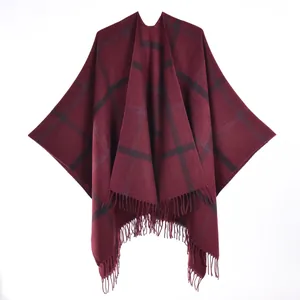 Detailed view of burgundy plaid shawl with soft cashmere feel and elegant long fringes
