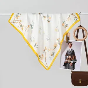 Elegant silk-like square scarf with floral magnolia print and yellow contrast border
