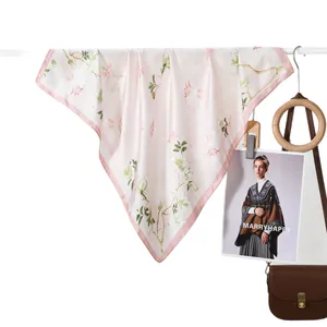 Elegant light pink floral silk scarf for women featuring magnolia patterns and silk texture