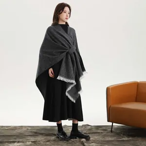 Vintage dark grey knitted shawl cape with white fringe detail and open front design