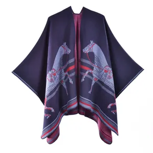 Deep blue poncho cape with symmetrical horse patterns and striped borders in thick knit fabric