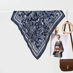 Classic navy blue paisley print scarf with white floral patterns and fringe edges