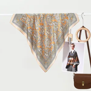 Classic paisley silk scarf for women in ginger yellow and beige with smooth satin finish