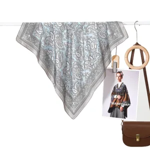 Classic paisley silk scarf in light blue and grey with elegant satin border finish