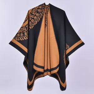 Thick double-sided knit shawl cape with black and camel geometric pattern