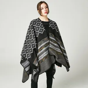 Women's knitted poncho with asymmetric geometric squares and grey-black striped patterns