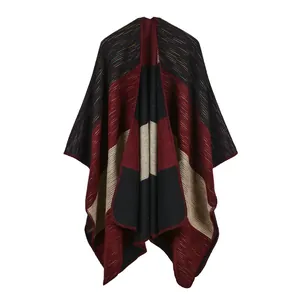 Detail of the thick knit texture and colorful stripe patterns on the poncho shawl