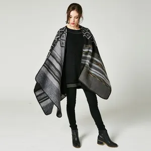 Detail view of the bohemian geometric pattern and premium knit texture on the poncho