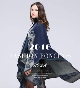 Detailed close-up of dark blue and gray poncho with retro floral patterns and stitching