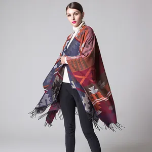 Macro detail of geometric pattern on thick cashmere poncho with black tassel fringe