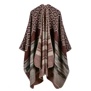 Close-up of geometric knit shawl showing detailed bohemian patterns and quality fabric
