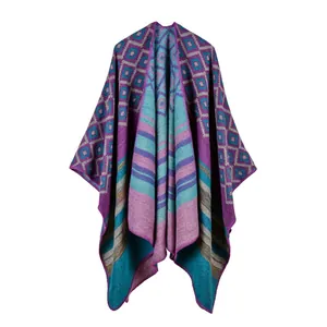 Macro detail of high-quality knitted poncho with geometric patterns and stripes