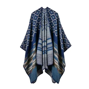 Close-up of thick knitted shawl featuring geometric jacquard patterns and colored stripes