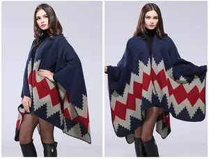 Detail of hand-stitched Aztec knit poncho with blue, red, and grey wave patterns