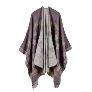 Close-up of thick knitted purple shawl featuring grey star patterns and bohemian jacquard trim